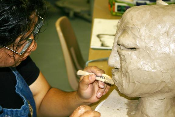 A student works on a sculpture project